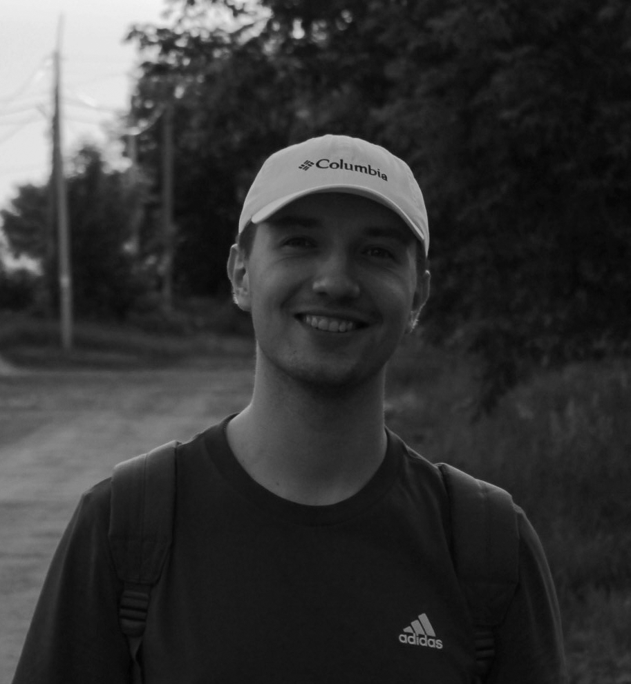 smiling person with a cap